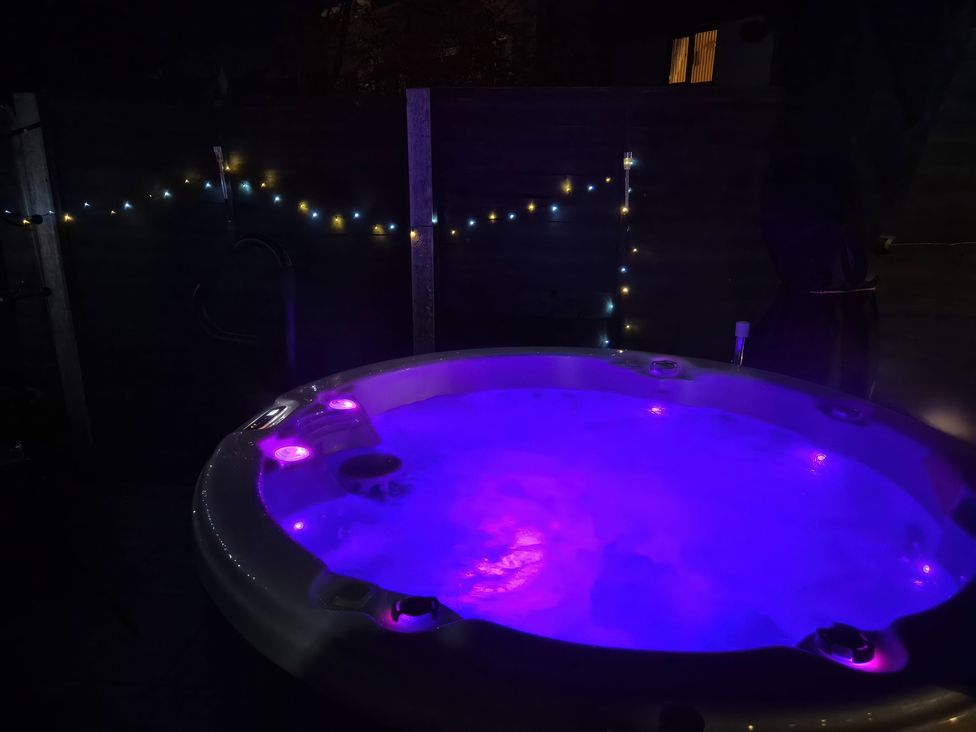 A hot tub with LED lights in an outdoor area at 63 Severn Street in Bridgnorth