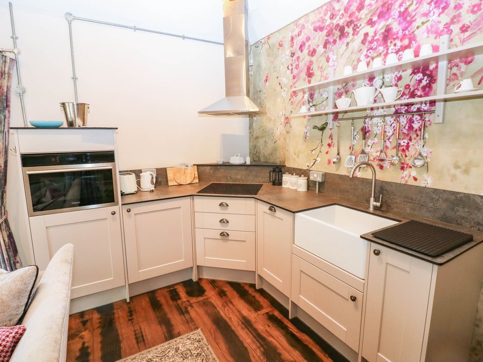 A kitchen with a sink and countertop at The Apple Store at Gileston Manor