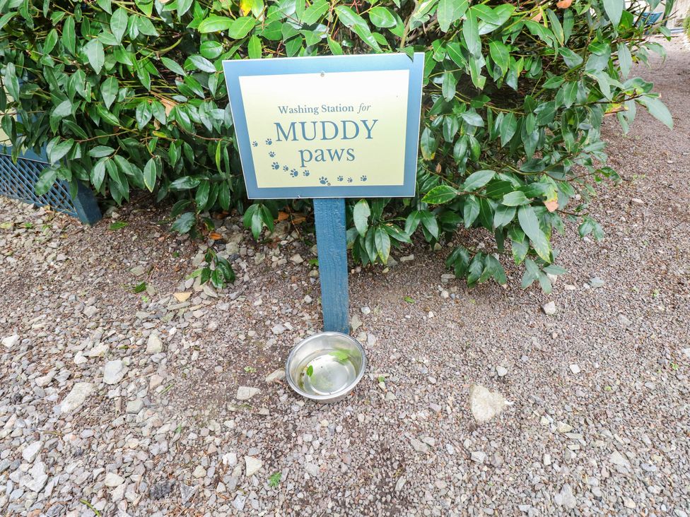 A washing station for muddy paws with a bowl at The Apple Store at Gileston Manor Gileston near St Athan