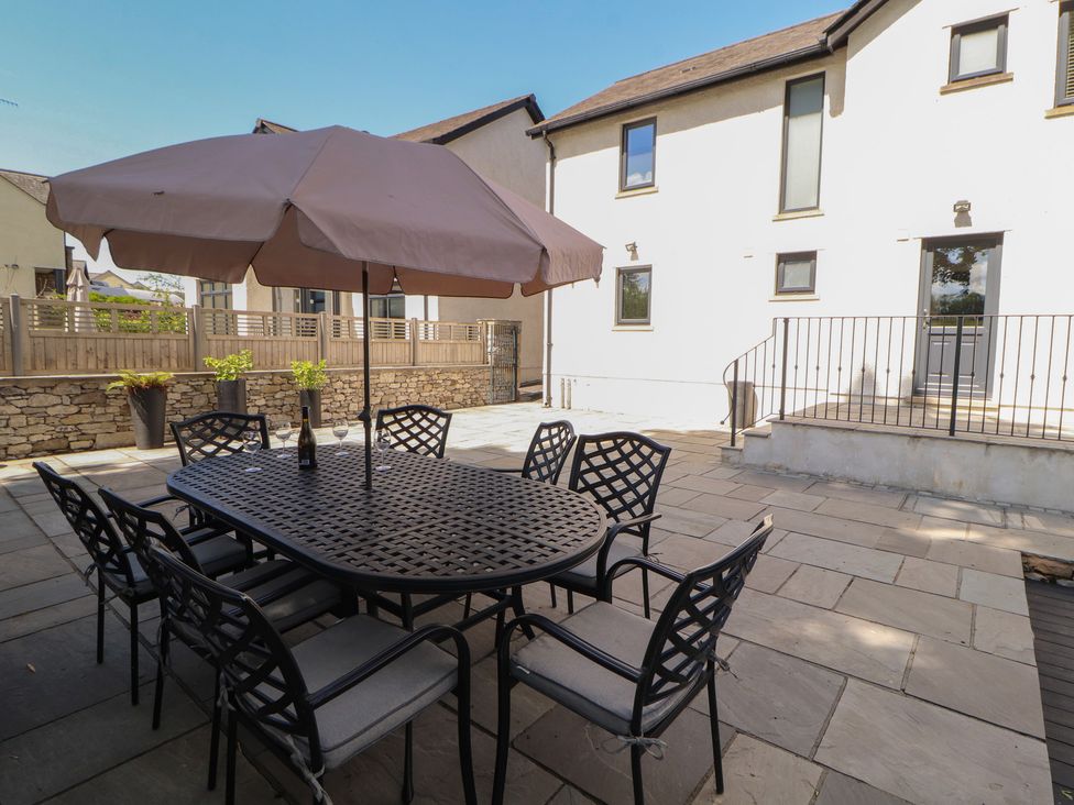 An outdoor dining area with a table and chairs at Ingleborough in Kirkby Lonsdale