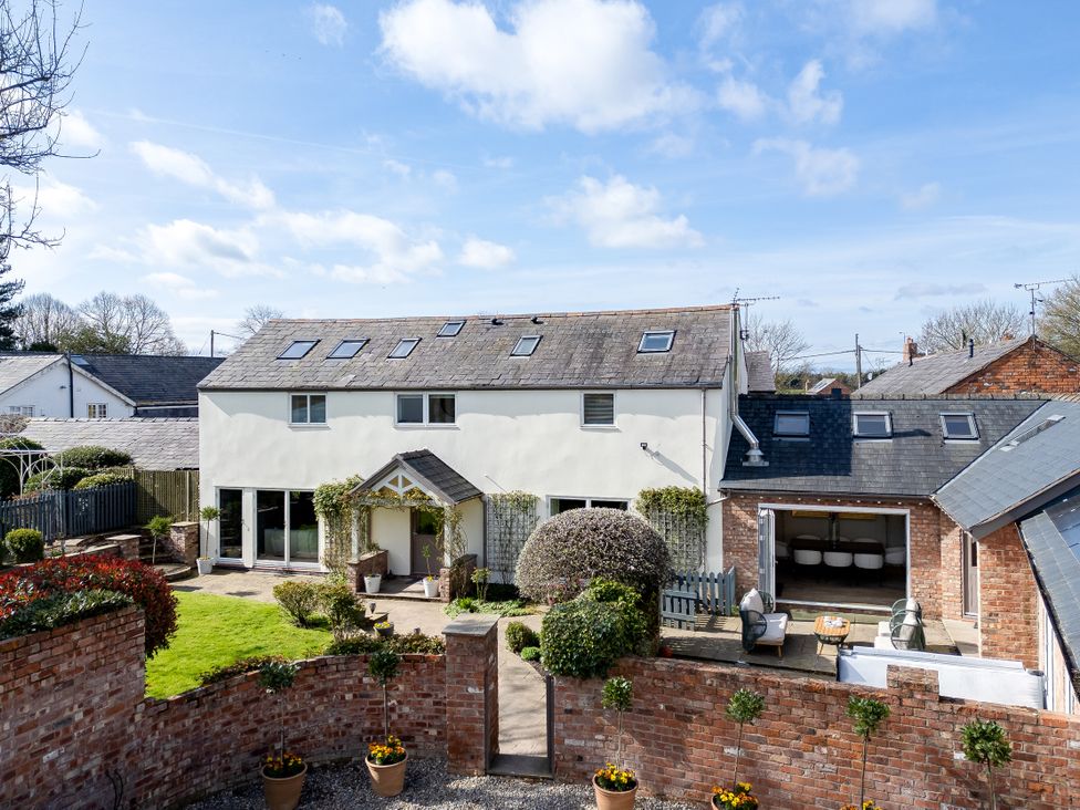 A house with a garden and potted plants at The Old Chase in Chester