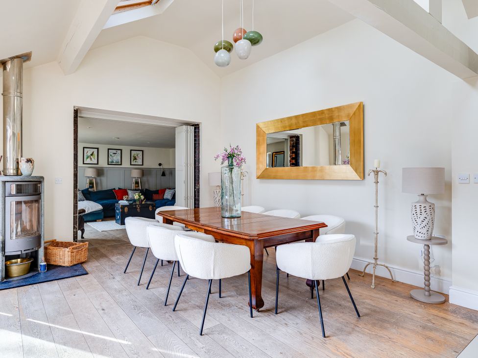 A dining room with a table and chairs at The Old Chase in Chester