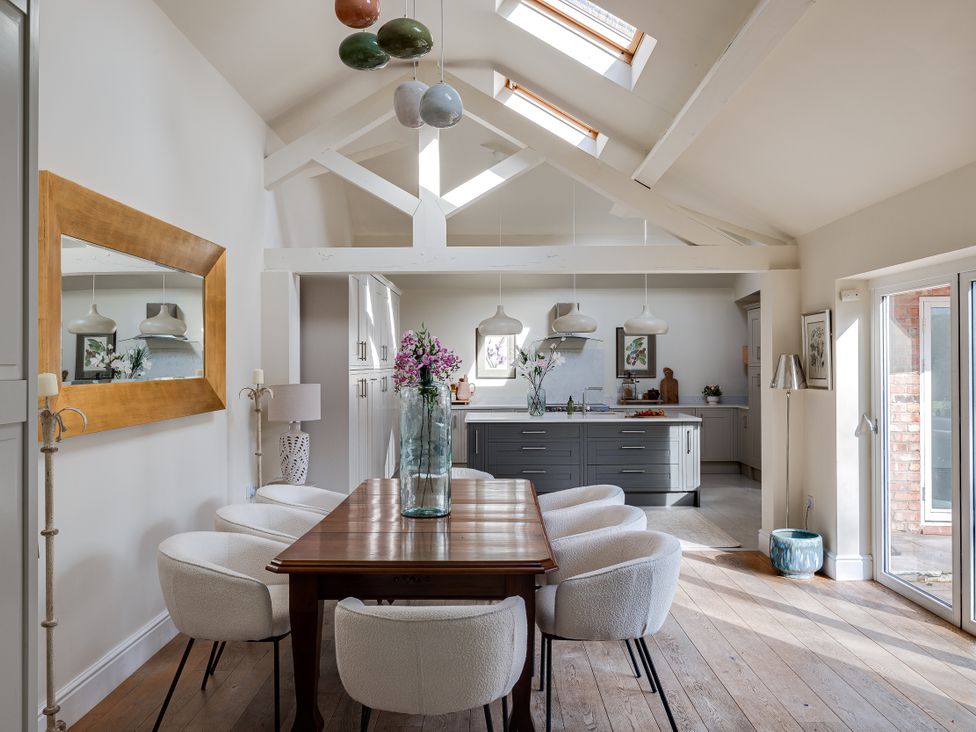 A dining room with a table and chairs at The Old Chase in Chester