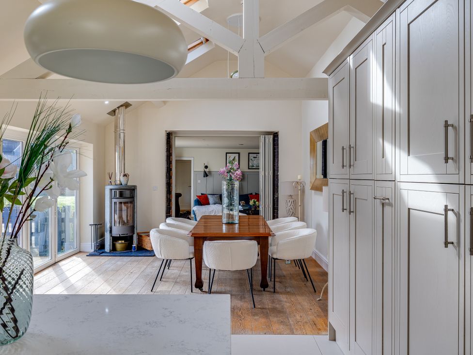 A dining room with a table and chairs at The Old Chase in Chester
