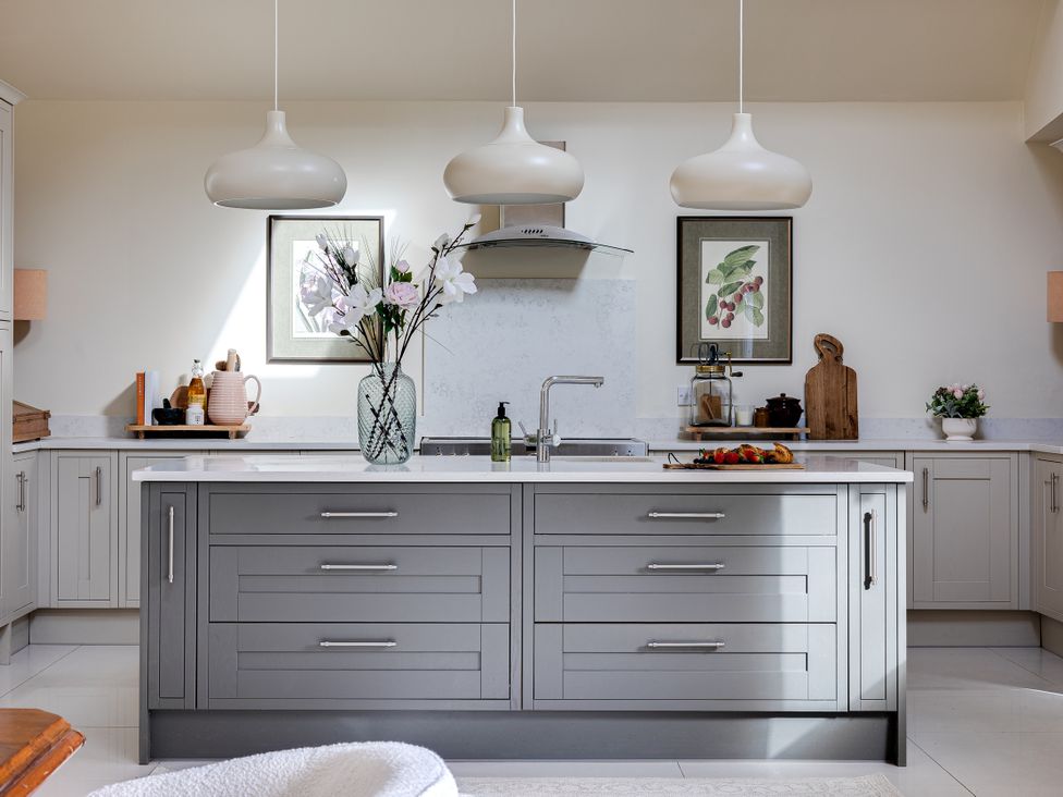 A kitchen with an island and sink at The Old Chase in Chester