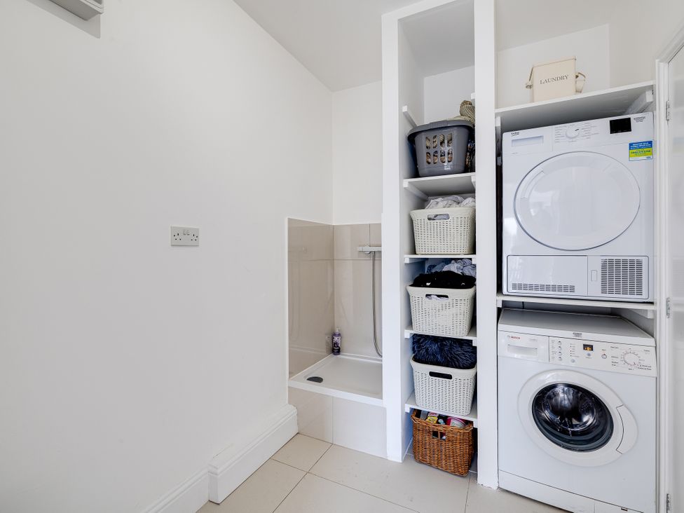 A laundry room with washing machine and tumble dryer at The Old Chase in Chester