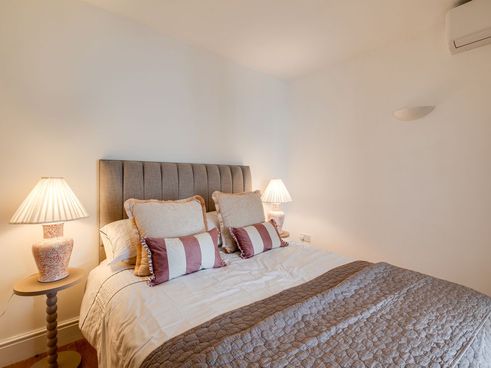 A bedroom with a bed and bedside lamps at The Old Chase in Chester
