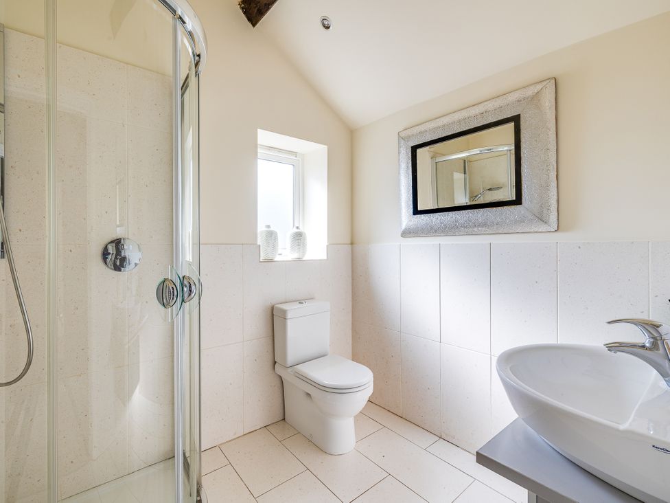 A bathroom with shower, toilet, sink and mirror at The Old Chase in Chester