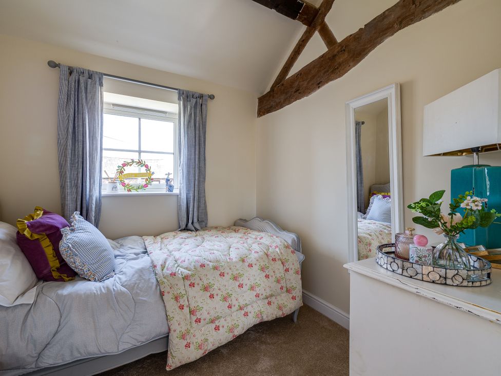 A bedroom with a bed and window at The Old Chase in Chester