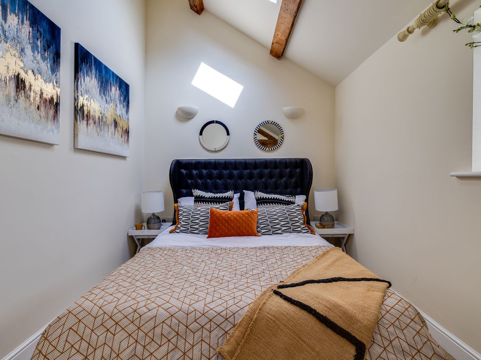 A bedroom with a bed and artwork on the wall at The Old Chase in Chester