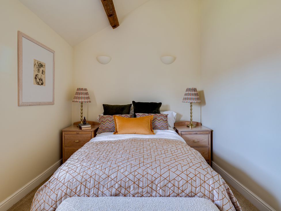 A bedroom with a bed and nightstands at The Old Chase in Chester