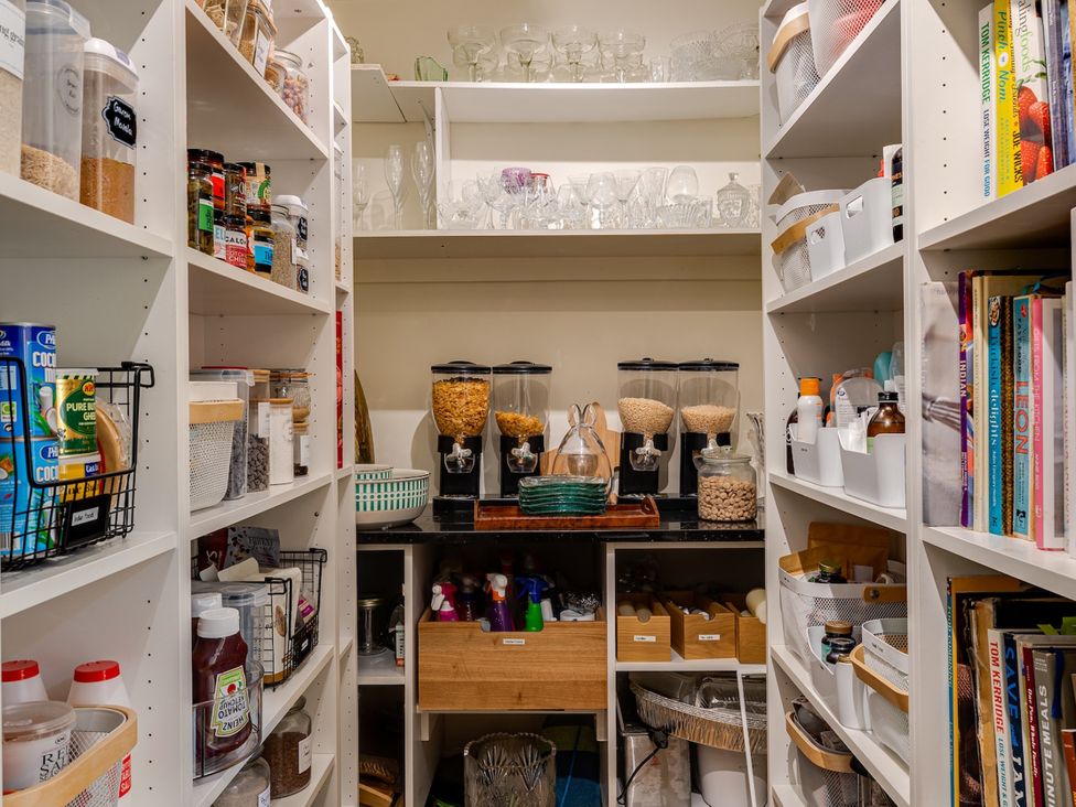A pantry with shelves of jars and containers at The Old Chase in Chester