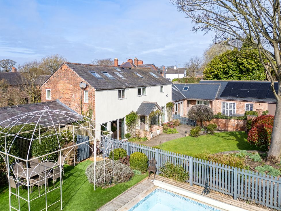 An outdoor area with a house and garden at The Old Chase in Chester