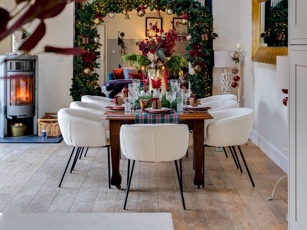 A dining room with a table and chairs at The Old Chase in Chester