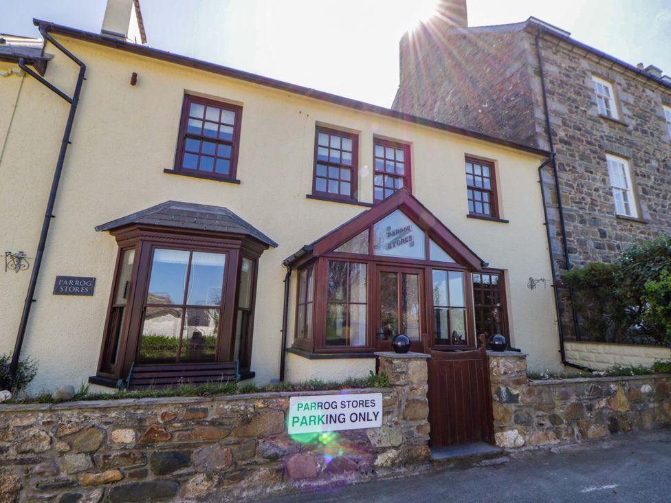 An exterior view of Parrog Stores with a parking sign in Parrog near Newport, Pembrokeshire