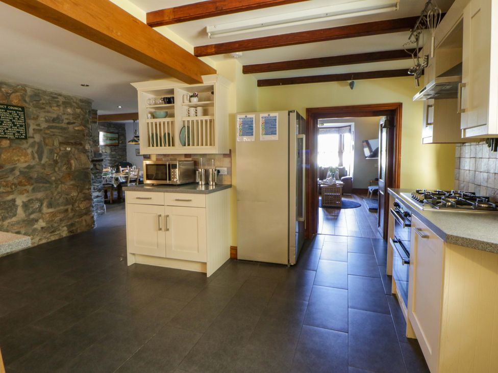 A kitchen with cabinets and appliances at Parrog Stores near Newport, Pembrokeshire