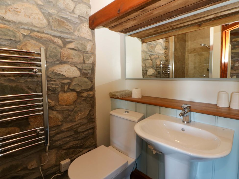 A bathroom with a sink and toilet at Parrog Stores near Newport, Pembrokeshire