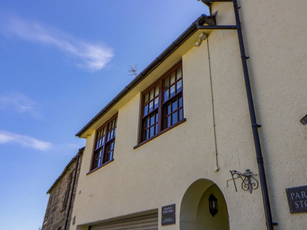 An exterior view of a building with windows and a sign at Parrog Bach Parrog near Newport, Pembrokeshire