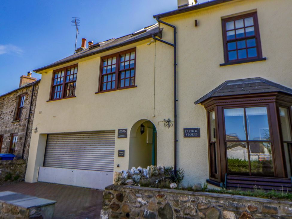 A house with windows and a garage at Parrog Bach in Parrog near Newport, Pembrokeshire