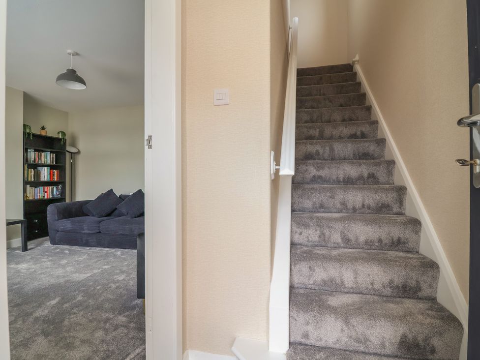 A staircase leading to upper floor at 7 Grantham Road in Southport