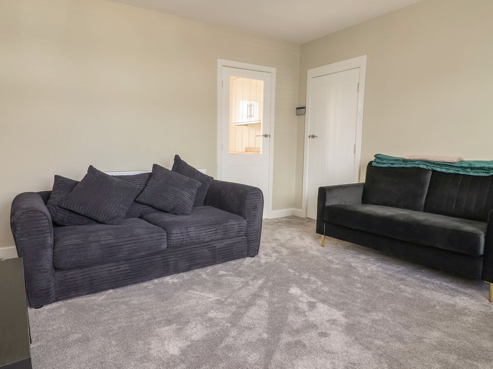 A living room with two sofas at 7 Grantham Road Southport