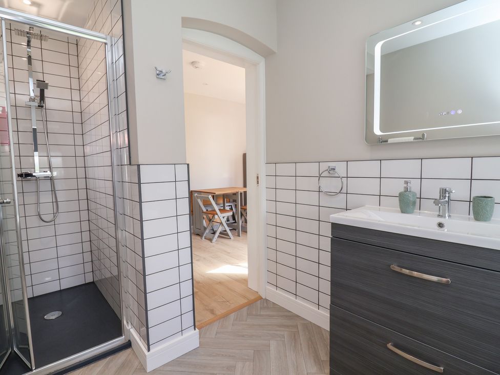 A bathroom with a shower and sink at 7 Grantham Road in Southport