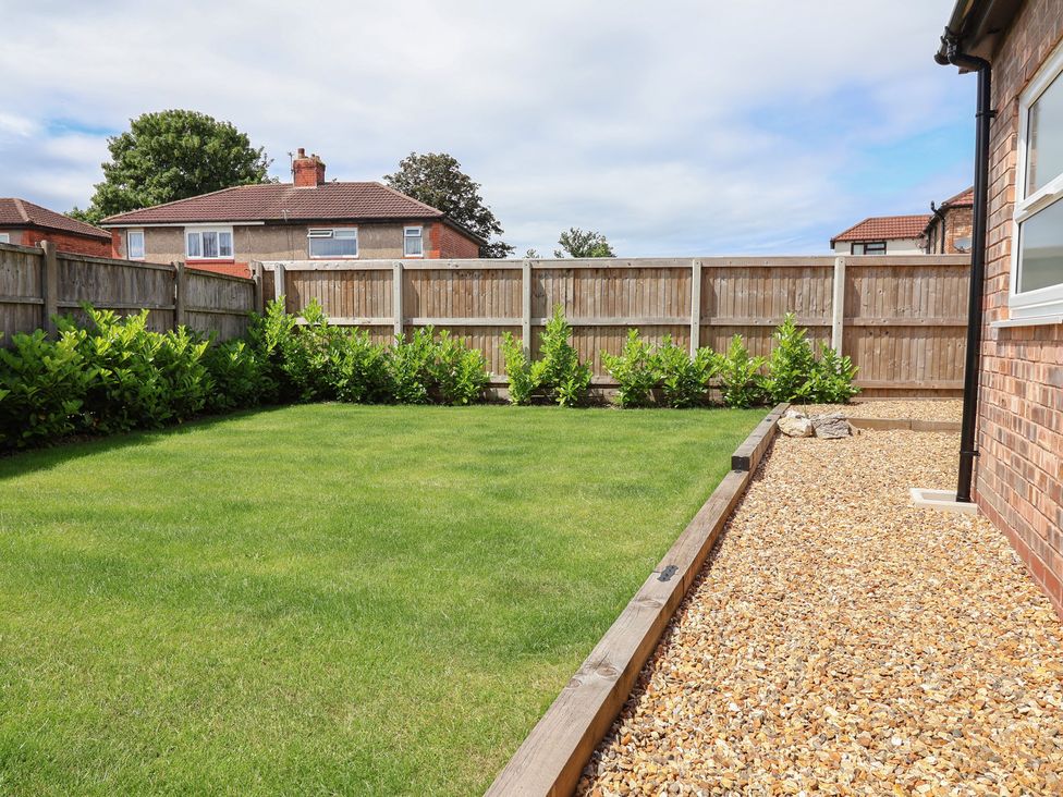 A garden with grass and gravel at 7 Grantham Road Southport