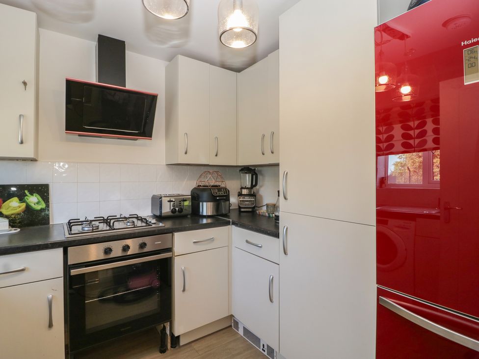 A kitchen with appliances and cabinets at 15 Hey Close Malvern