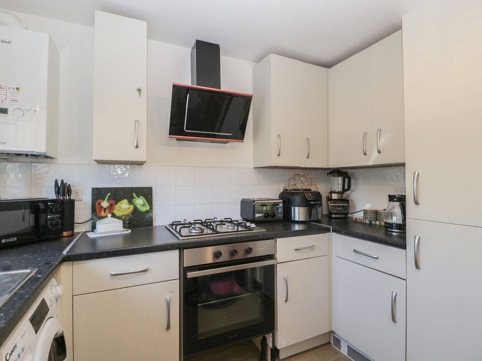 A kitchen with appliances and cabinets at 15 Hey Close Malvern
