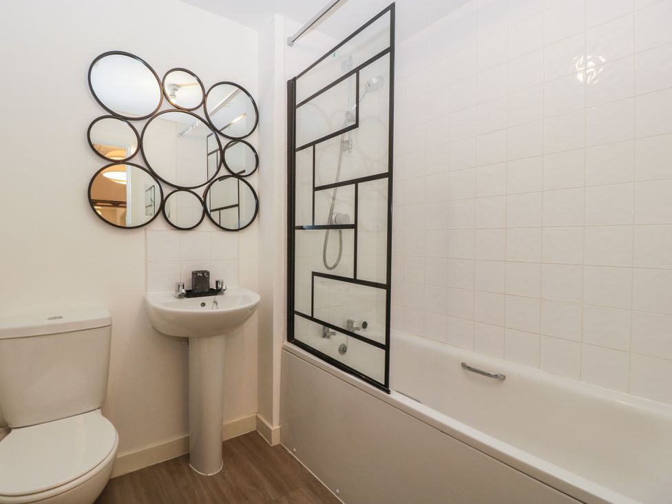 A bathroom featuring a shower, bathtub, toilet, and sink at 15 Hey Close Malvern