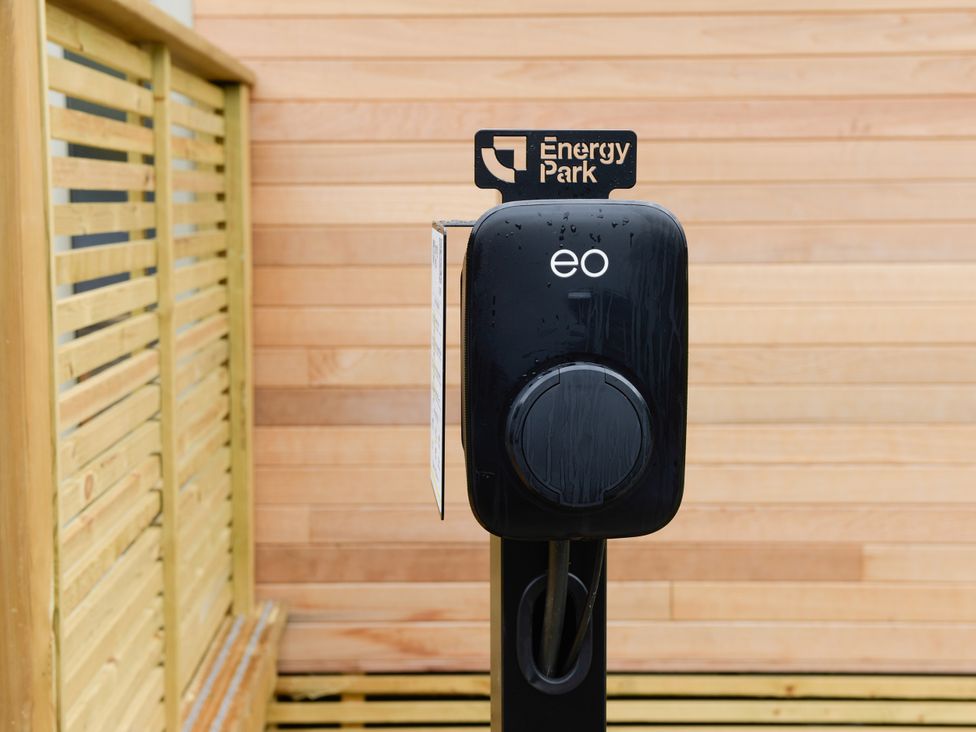An electric vehicle charger mounted in an outdoor area at Energy Park in Dobwalls
