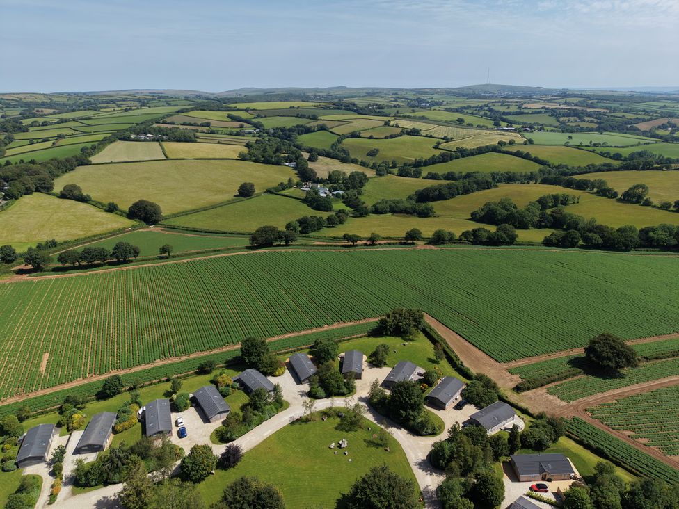 An aerial view of a rural area with multiple villas and fields at 23 Meadow Retreat in Dobwalls