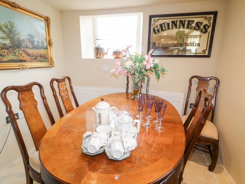 A dining room with a table set for tea at Crea The Mission Hall near Ballymena