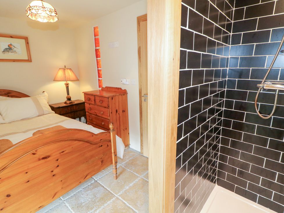 A bedroom featuring a bed and a shower at Crea The Mission Hall near Ballymena