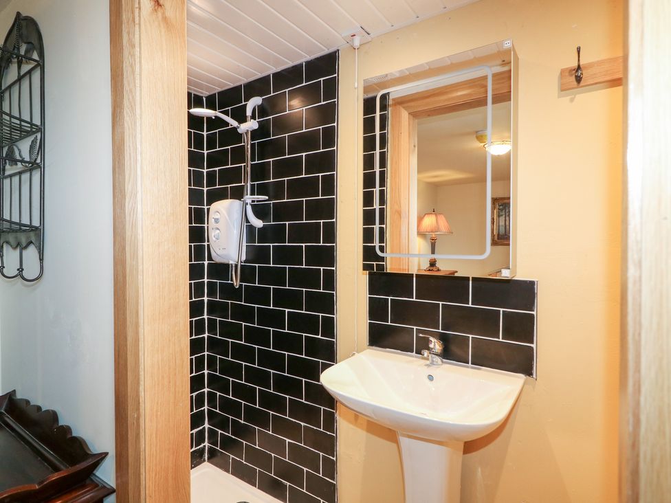 A bathroom with shower and sink at Crea The Mission Hall near Ballymena