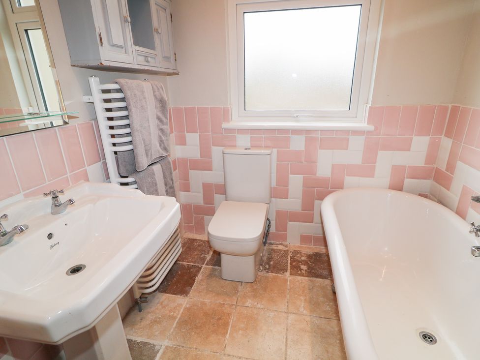 A bathroom with a sink, toilet, and bathtub at Crea The Mission Hall near Ballymena