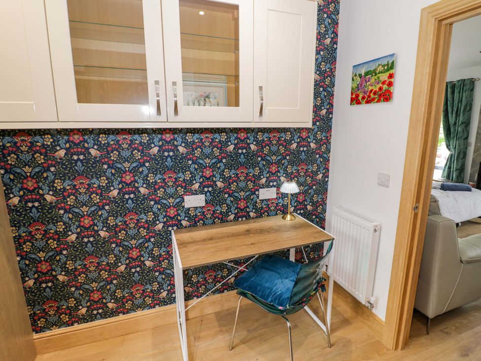 A workspace with a desk and chair at The Barn in Astwood Bank