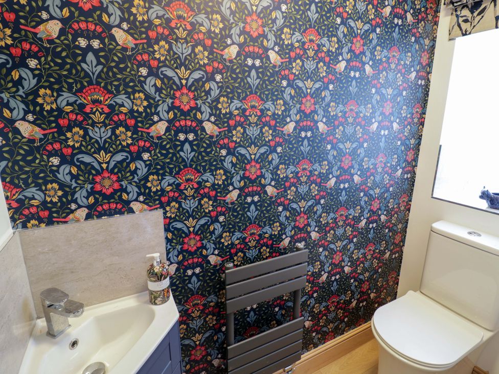 A bathroom with a sink and toilet at The Barn in Astwood Bank