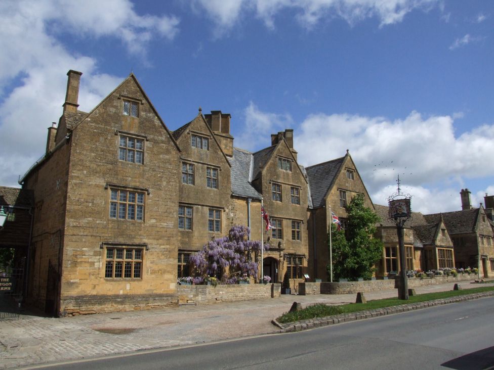 A building with windows and flags at Bay House Cottage in Broadway