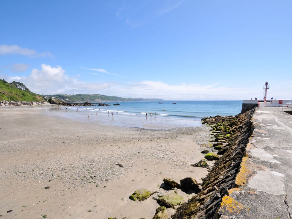 A beach with people at Sea Pinks in Looe