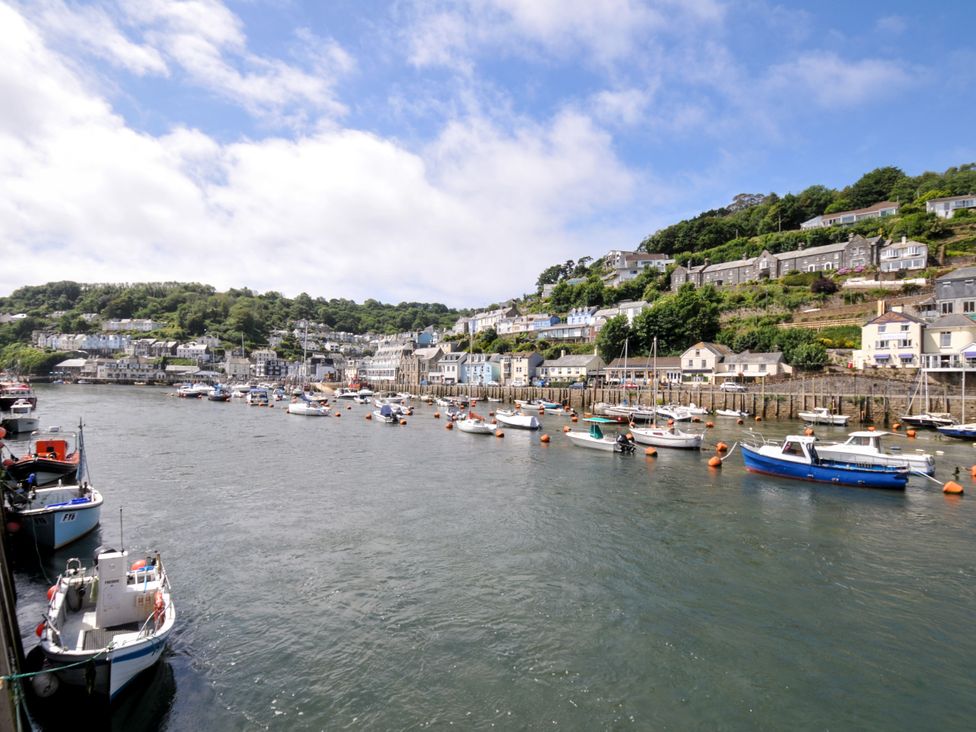 A view of a harbor with boats and buildings at Sea Pinks in Looe
