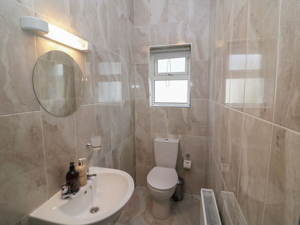 A bathroom with toilet and sink at No 1 Lodge Wood Kenmare, County Kerry