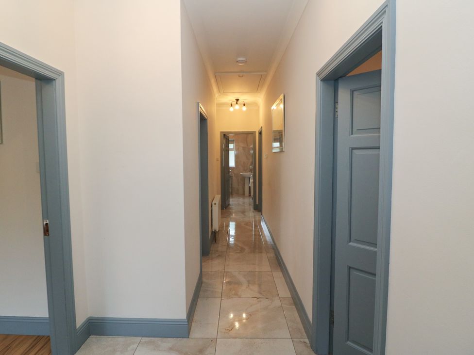 A hallway with doors and lights at No 1 Lodge Wood, Kenmare, County Kerry