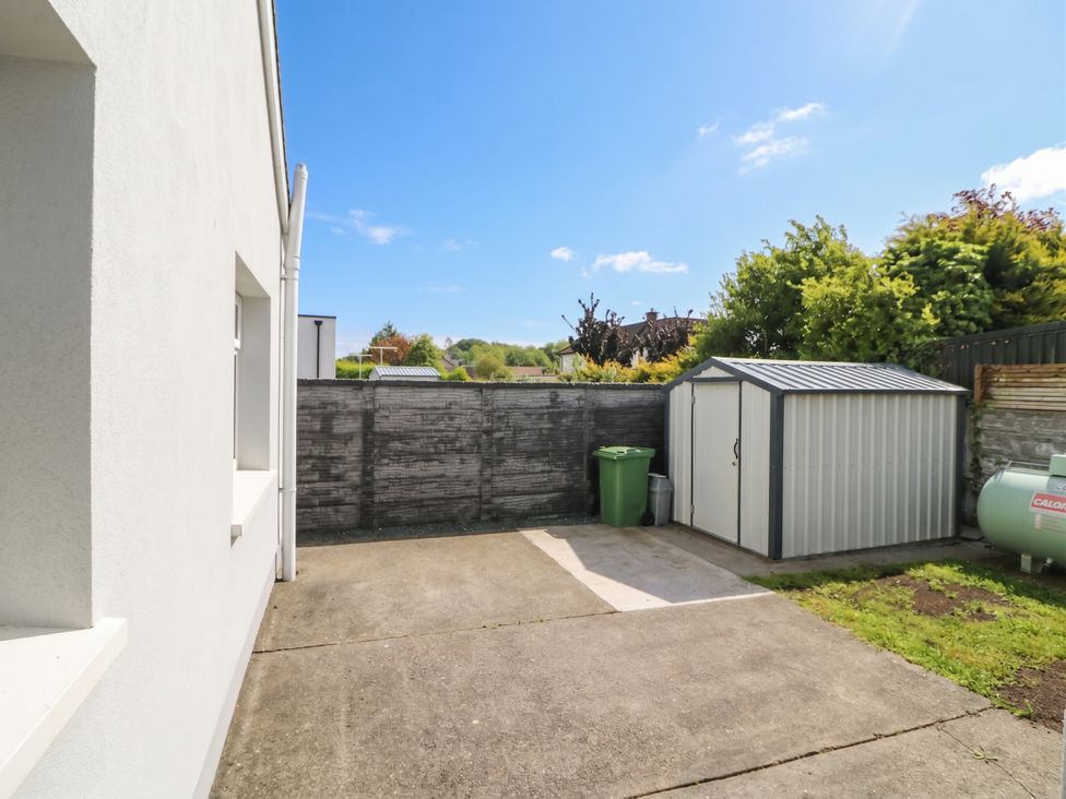 An outdoor space with a shed and green bin at No 1 Lodge Wood Kenmare, County Kerry