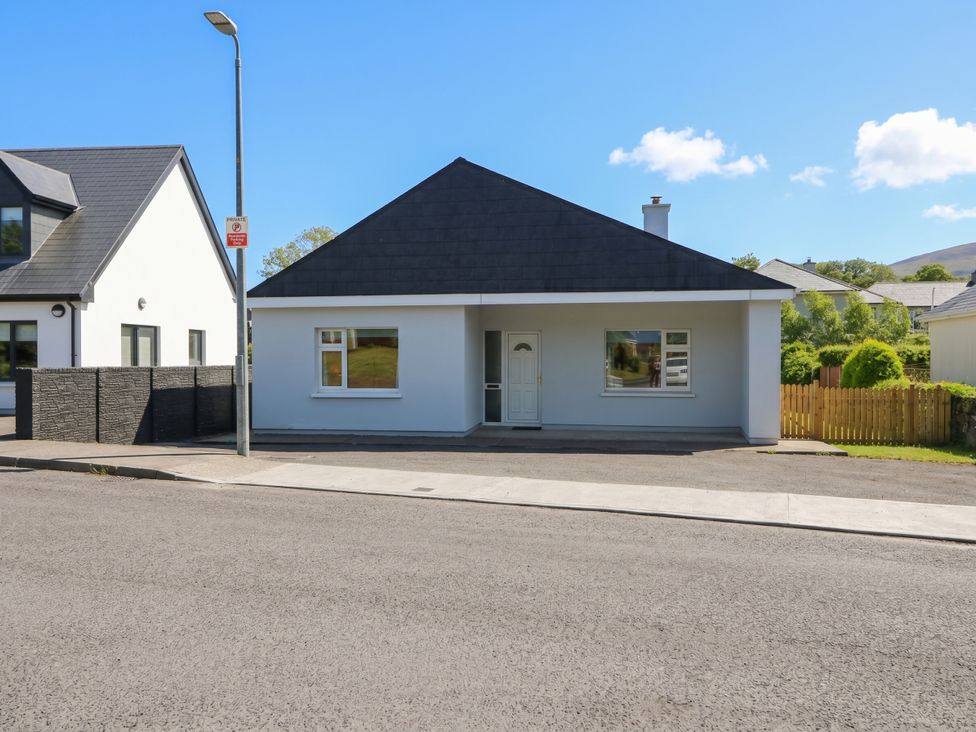 A house with a front door and windows at No 1 Lodge Wood in Kenmare, County Kerry