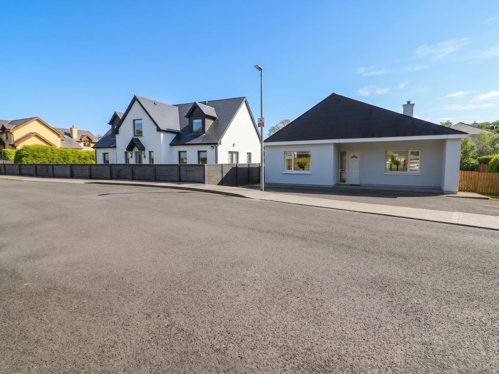 Two houses next to each other on a street at No 1 Lodge Wood, Kenmare, County Kerry