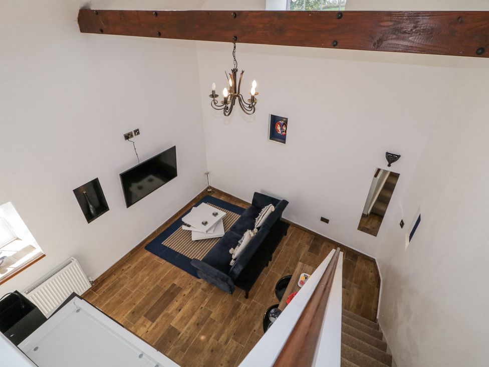 A living room with a sofa and table at Derrywilligan 1,2,3 in Newry