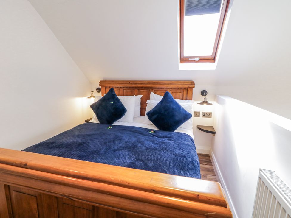 A bedroom with a bed and pillows at Derrywilligan 1,2,3 in Newry