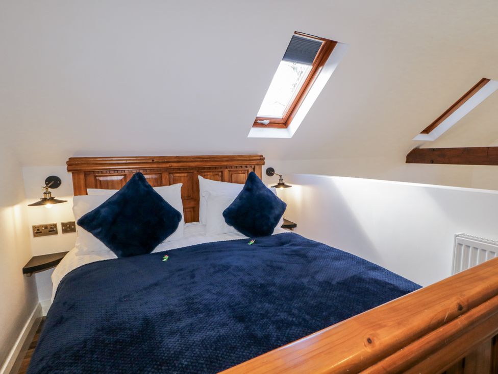 A bedroom with a bed and skylights at Derrywilligan 1,2,3 in Newry