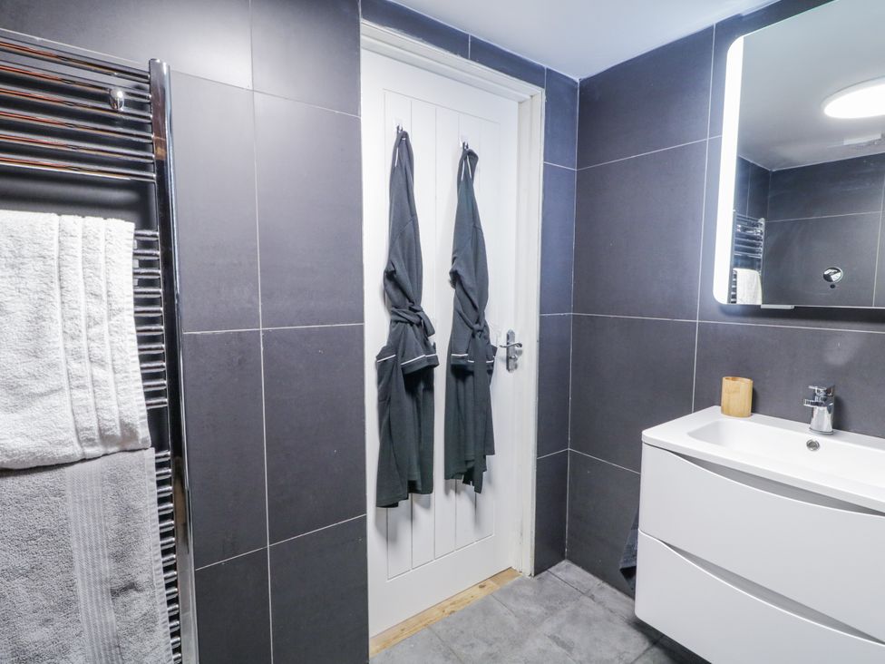 A bathroom with a towel rail and sink at Derrywilligan 1,2,3 Newry